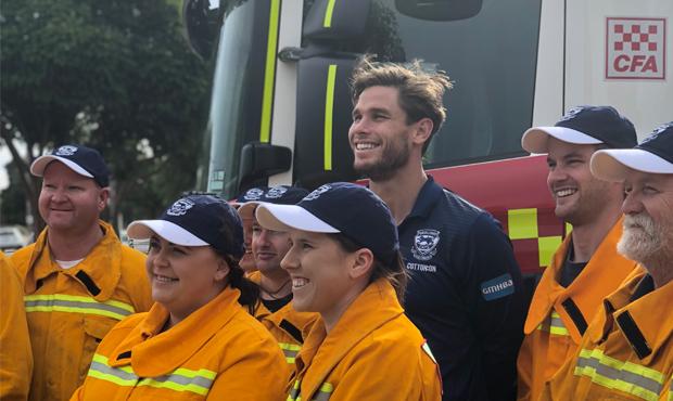 TomCFA.jpg Cats forward Tom Hawkins with some CFA volunteers. - Geelong Cats